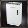 A white kitchen cabinet with a stainless steel sink and a silver handle, set against a dark background with a decorative border. Náhľad obrázku produktu