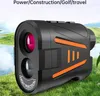 A laser rangefinder is shown in a natural outdoor setting with grass and water in the background. Produktbild-Vorschau