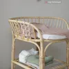 A rattan changing table with baby items. Produktbild-Vorschau