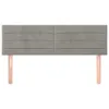A headboard with two wooden legs attached. Produktbild-Vorschau