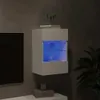 A white wall-mounted cabinet with blue LED lighting is shown in a dimly lit room, next to a black television screen and a potted plant. Anteprima dell’immagine prodotto