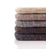 A stack of six round cushions in various earthy tones, presented against a white background. Podgląd zdjęcia produktu