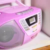 A close-up shot of a pink Blaupunkt boombox with a silver speaker grill and control panel. Produktbild-Vorschau