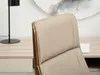 A close-up view of the headrest of a chair, with a desk and lamp in the background. Anteprima dell’immagine prodotto