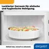 Inside of a microwave with a dish of food. Produktbild-Vorschau