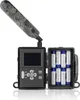 A trail camera with its battery compartment open, showing batteries inside. Voir les images du produit