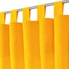 A close-up view of bright orange curtains hanging from a metal rod. Produktbild-Vorschau