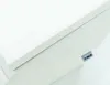 A close-up view of a white mattress or foam pad, with a small gray label attached to the side. Náhľad obrázku produktu