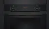 Close-up of the control panel and door of a black oven. Produktbild-Vorschau