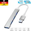 A silver USB hub with four ports and a white cable is shown against a white background. Logos and text indicating product features are present. Produktbild-Vorschau