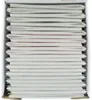 A stack of softcover albums in a box. Voir les images du produit