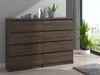 A dark wood dresser with eight drawers is shown in a room with a large window and plants. Produktbild-Vorschau