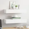 Two white floating shelves mounted on a white wall, decorated with a framed plant picture, a small cactus, and a white vase on books. Produktbild-Vorschau