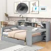A modern gray daybed with built-in storage, desk, and shelves, set in a bedroom with a desk and artwork in the background. Produktbild-Vorschau