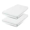 Two white mattresses stacked on top of each other, with a blue stripe around the edges. Produktbild-Vorschau
