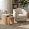 A cozy living room scene with a chair and nesting tables. Produktbild-Vorschau