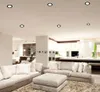 A modern living room and kitchen area with recessed ceiling lights. Produktbild-Vorschau