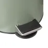 A close-up view of the pedal mechanism of a trash can. Podgląd zdjęcia produktu