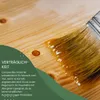 A close-up of a paintbrush applying oil to a wooden surface, with text overlay. Produktbild-Vorschau