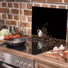 A kitchen scene with a glass splashback featuring an image of coffee beans spilling from a cup. Náhľad obrázku produktu