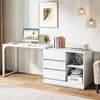A white L-shaped desk with a computer, printer, and storage drawers in a home office setting. Voir les images du produit
