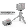 A magnetic quick-release mount for a sports camera is shown attached to the camera and a tripod, with another camera base shown separately. Produktbild-Vorschau
