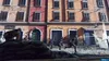 Soldiers in combat in a city street, with buildings in the background. Produktbild-Vorschau