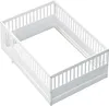 A white wooden children's bed frame with safety rails and a small opening for entry. Produktbild-Vorschau