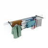 A wall-mounted drying rack with clothes hanging on it. Produktbild-Vorschau