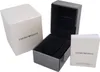 The image shows the packaging for an Emporio Armani watch, including the outer box, the watch case, and an instruction booklet. Voir les images du produit