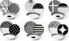 A collection of black and white patterned dinnerware sets arranged in a grid. Produktbild-Vorschau