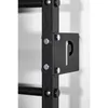 A close-up view of a black metal wall-mounted fitness apparatus, showing a bracket with the letter 'P' cut out, attached to the main frame with bolts. Produktbild-Vorschau