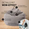 A light gray beanbag chair with various features highlighted by text and plus icons, and a small inset image of a person loading laundry into a washing machine. Voir les images du produit