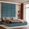 A bedroom scene with a bed and a large upholstered headboard. Anteprima dell’immagine prodotto