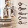 A white octopus-shaped drying rack with clothes on it, set against a light gray and white background with marketing text and icons on the right. Produktbild-Vorschau