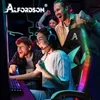 People playing video games together, celebrating a victory. A gaming chair with RGB lighting is prominently featured. Produktbild-Vorschau