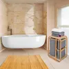 A modern bathroom with a freestanding bathtub and a bamboo laundry basket. Produktbild-Vorschau