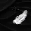 A close-up shot of a black fabric with a white feather and text overlay. Produktbild-Vorschau