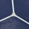 A close-up view of a white plastic connector joining three white poles, set against a textured blue background. Náhľad obrázku produktu