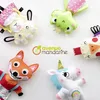 A collection of five handmade felt toys, including a fox, a unicorn, a frog, a lamb, and a bird-like creature, arranged on a white background. Produktbild-Vorschau