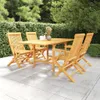 A wooden dining set with four chairs and a table is arranged on a paved patio, surrounded by lush green hedges and trees. Produktbild-Vorschau