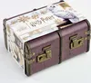 A Harry Potter themed advent calendar shaped like a trunk, with a decorative band around it. Produktbild-Vorschau