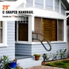 A black C-shaped handrail is mounted on the side of a house next to a set of outdoor steps. Anteprima dell’immagine prodotto