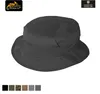 A black bucket hat shown from a front-facing angle with a small patch on the top. Below the hat are swatches of different colors and patterns. Podgląd zdjęcia produktu