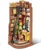 A miniature, detailed diorama of a study room inside a bookshelf. Náhled obrázku produktu
