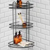 A black metal corner shower caddy filled with bathroom products against a white subway tile wall. Podgląd zdjęcia produktu