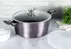 A pot with a glass lid is placed on a countertop, with a small bowl of white powder and a bunch of herbs in the background. Podgląd zdjęcia produktu