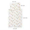 A baby duvet and pillow set with a woodland animal print, with dimensions indicated by text overlays. Produktbild-Vorschau
