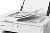 A close-up view of a white Canon printer with documents in the scanner bed. Podgląd zdjęcia produktu