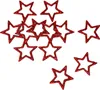 A collection of red glitter star-shaped cutouts scattered on a white background. Produktbild-Vorschau